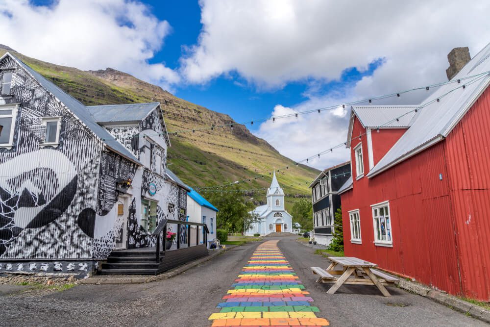 Rainbow street in Seydisfjordur East Iceland Lagoon car rental.
